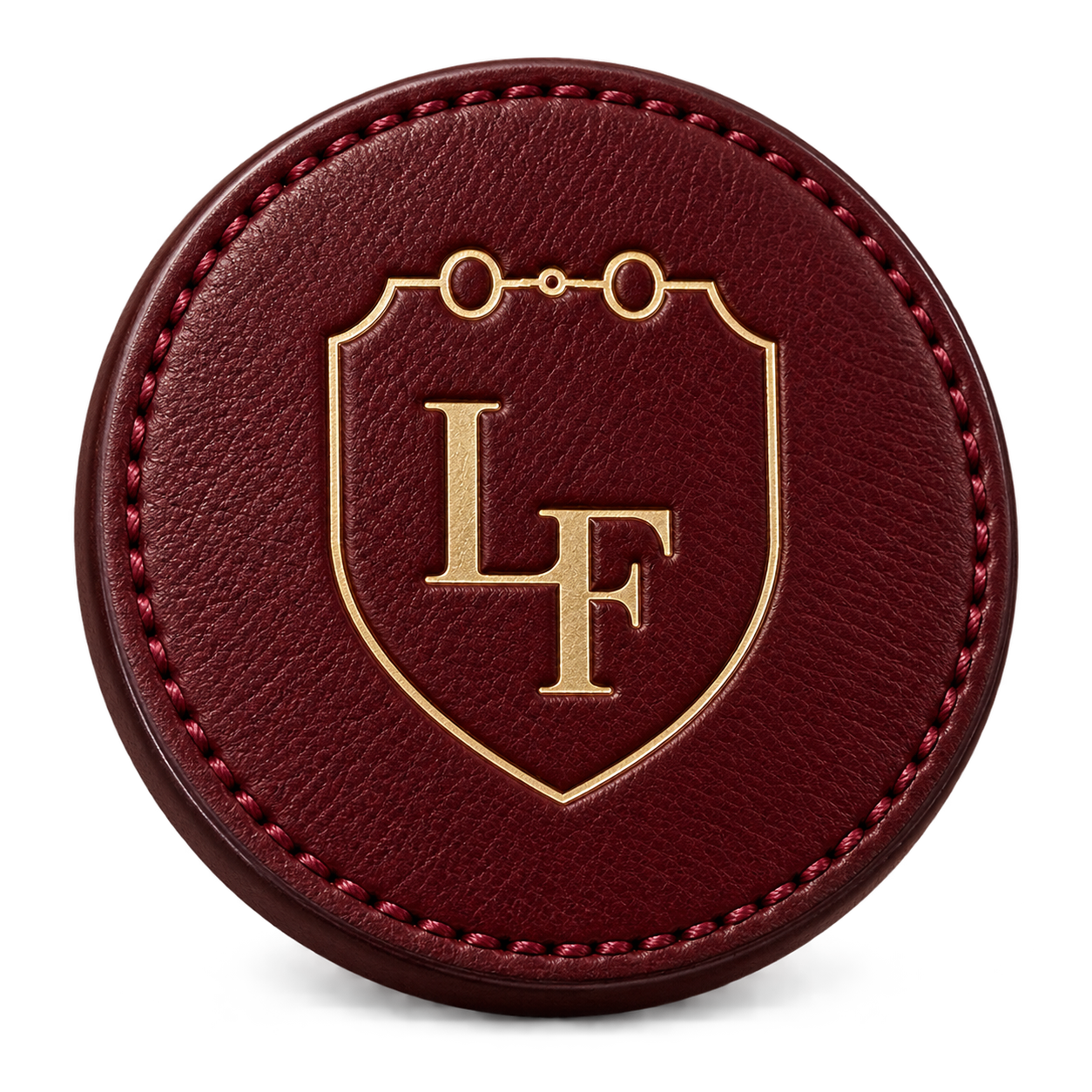 The LA FORZA crest in a wine leather medallion